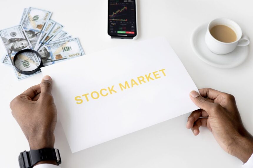 Asset allocation – business theme with stock market document, currency and mobile display