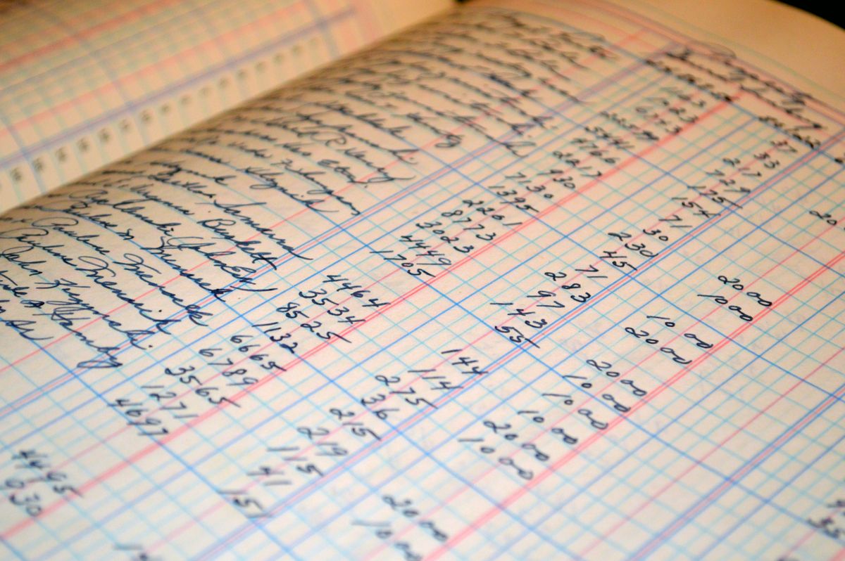 Bookkeeping for small business – handwritten ledger with financial records