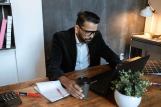 Business line of credit – small business owner reviewing finances on a laptop
