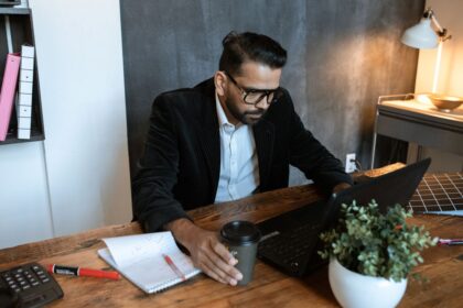 Business line of credit – small business owner reviewing finances on a laptop