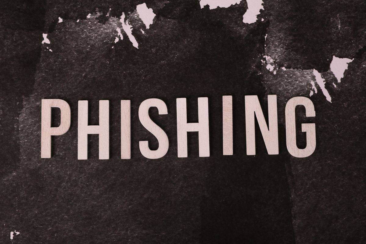 Crypto scams – phishing warning concept on a dark background