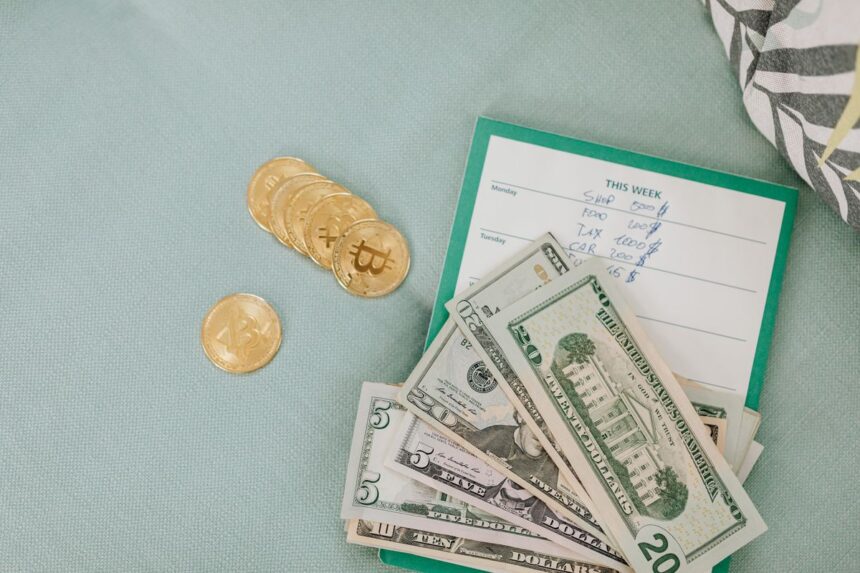 Crypto taxes – uS dollars and Bitcoin coins on a budget planner