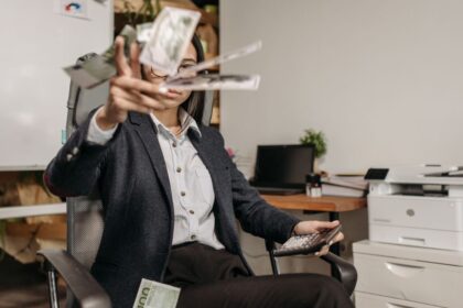 Entry-level salary – young professional calculating finances in an office