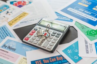 How much house can I afford – calculator and real estate flyers for planning a home purchase