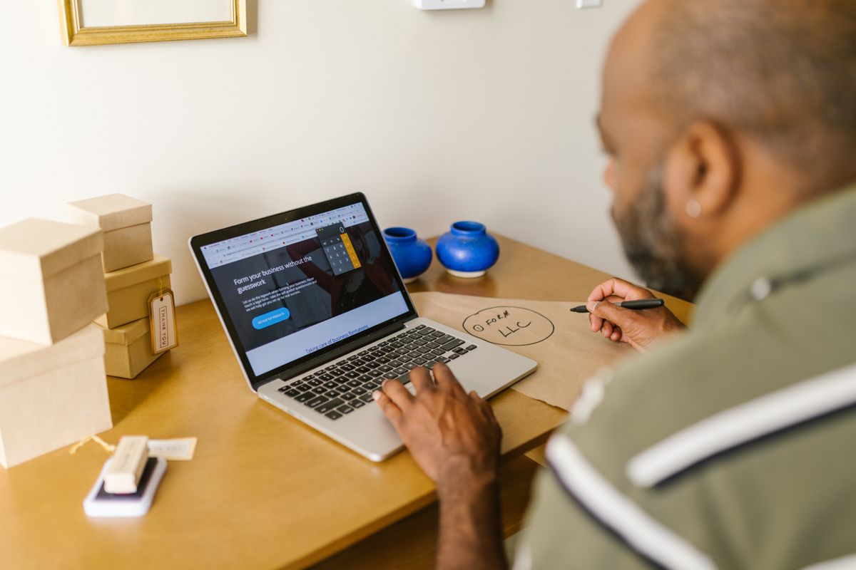 LLC for side hustle – entrepreneur planning a business on a laptop