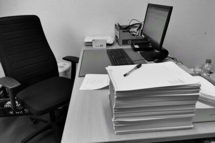 LLC vs sole proprietor vs S corp – office desk with business paperwork and a computer
