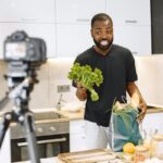 Make money on YouTube – creator filming a cooking video for YouTube in a kitchen
