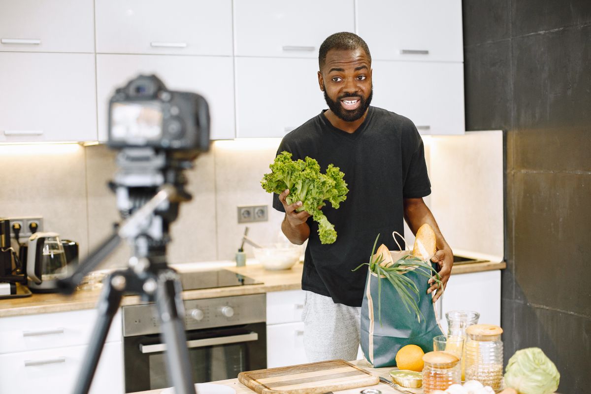 Make money on YouTube – creator filming a cooking video for YouTube in a kitchen