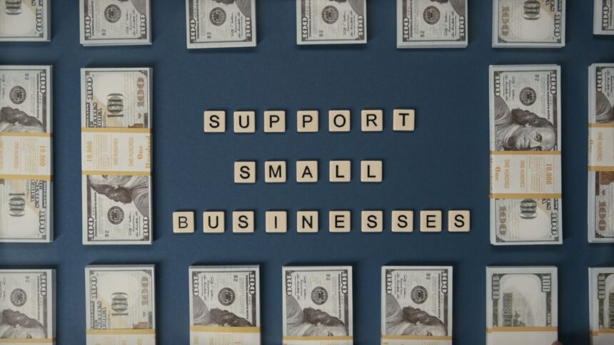 Small business grant – dollar bills and letter tiles promoting small businesses