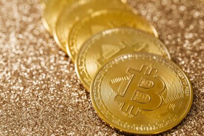 What is Bitcoin – golden Bitcoin coins on a glittering background