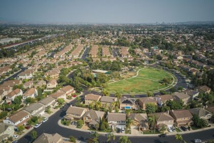 Will house prices drop – drone shot of a suburban neighborhood with many houses