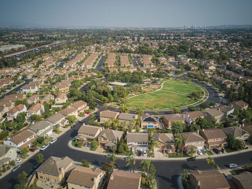 Will house prices drop – drone shot of a suburban neighborhood with many houses